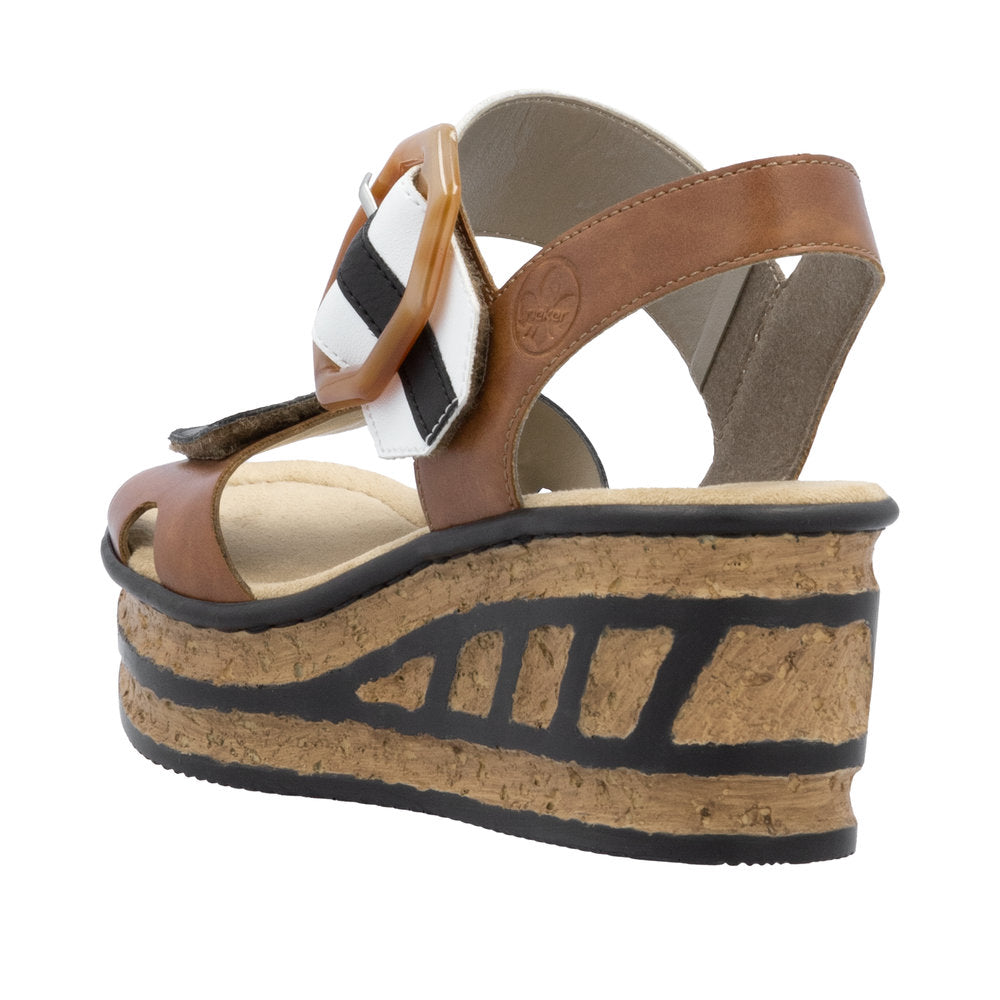 Platform sandals with a light brown strap, a buckle with black and white stripes, and a cork sole with black accents.