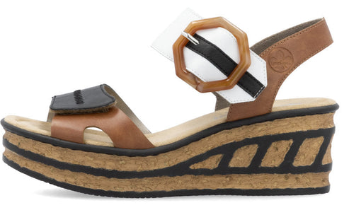 Platform sandal with tan brown, black, and white straps and buckle detail.