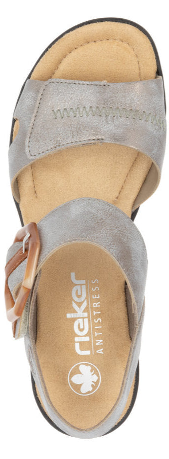 A top-down view of a sandal, featuring an adjustable buckle.