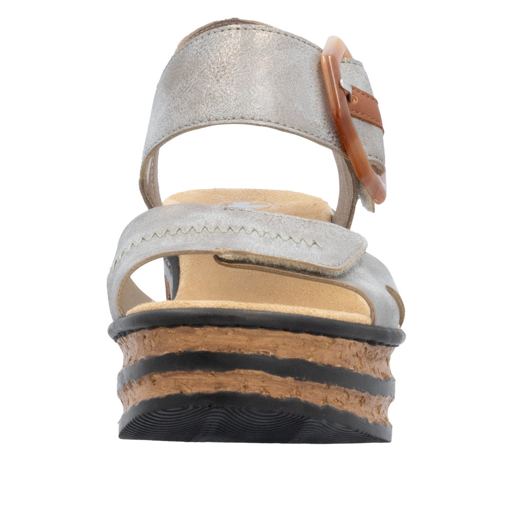 Front view of a silver sandal with a stacked cork platform.