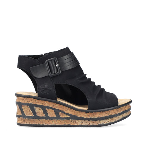 Black wedge sandal with buckle, cork sole, and peep toe.