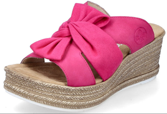 Pink wedge sandal with knotted bow on straps.