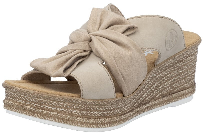 Sand-colored wedge sandal with knotted fabric upper.