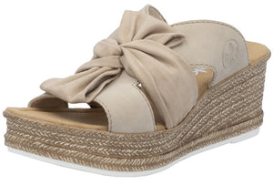 Sand-colored wedge sandal with knotted fabric upper.