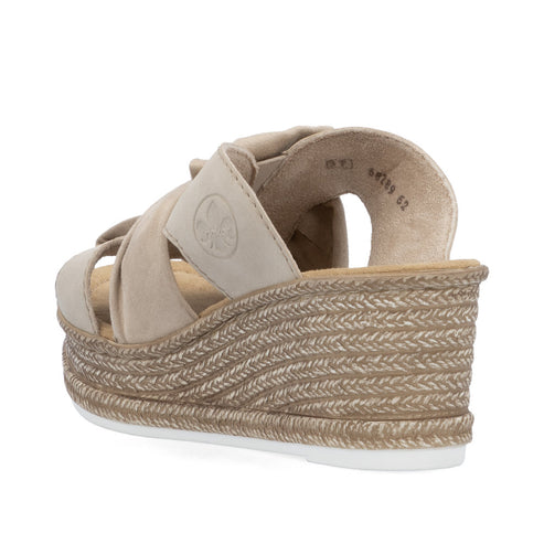 Beige slide sandal with wedge heel and interwoven straps.