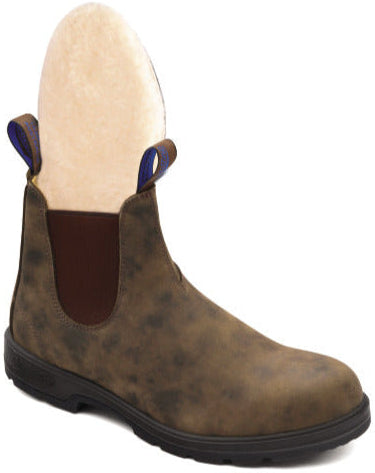 Brown ankle boot with a rounded toe, elastic side panel and a blue pull tab.