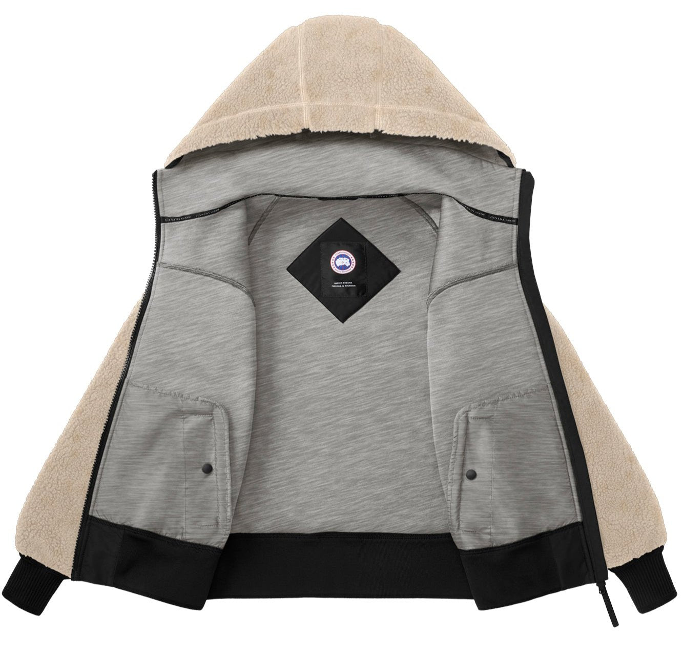 Open beige sherpa-lined hoodie with gray interior and a centered logo patch.