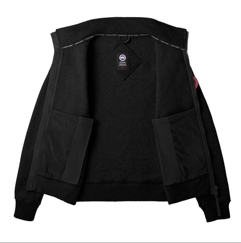 Open black jacket featuring inner pockets and the Canada Goose logo.