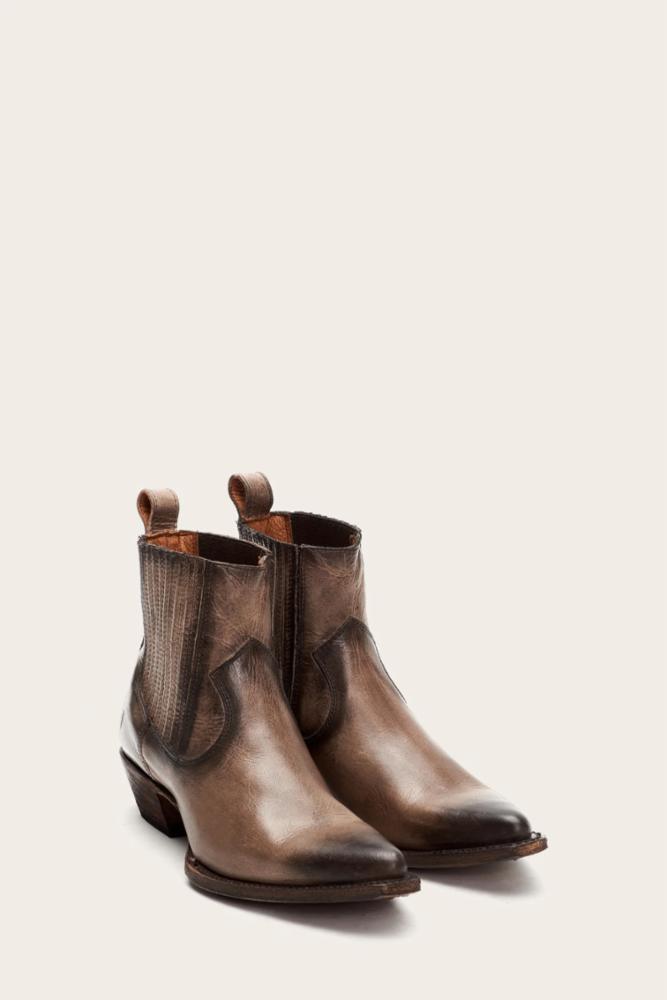 A pair of light brown leather ankle boots.