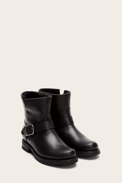 Pair of black leather mid-calf boots with buckle detail