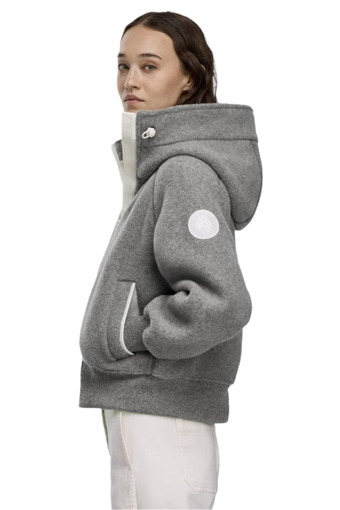 Gray wool hooded jacket with white trim, visible round logo on arm.