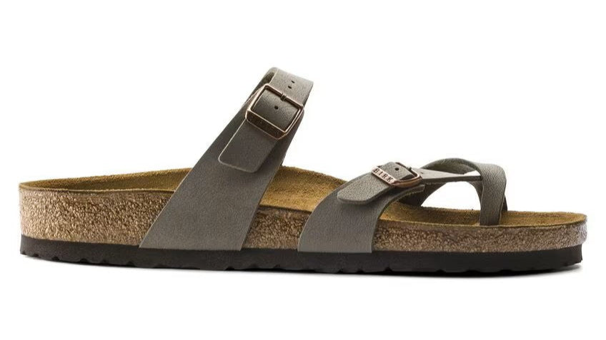 Taupe colored sandal with buckle closures and cork sole.