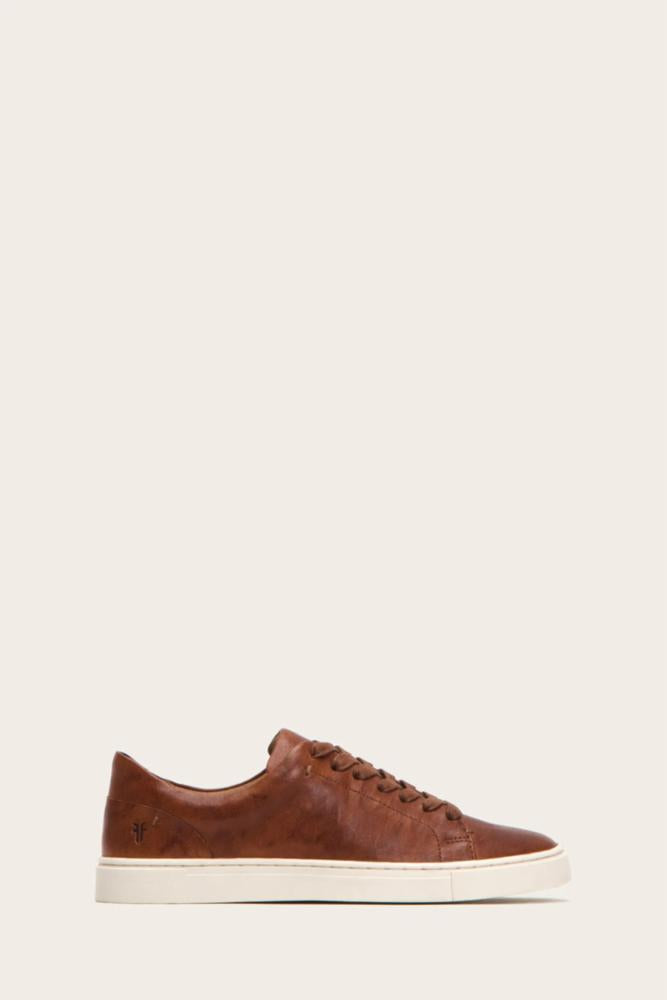 Low-top brown leather sneaker with white sole.