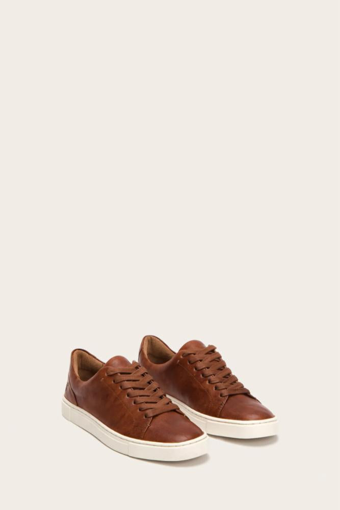 Pair of brown leather sneakers with white soles.