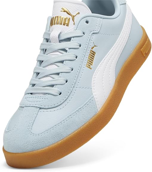 Light blue sneaker with brown sole, white stripe, and gold lettering.