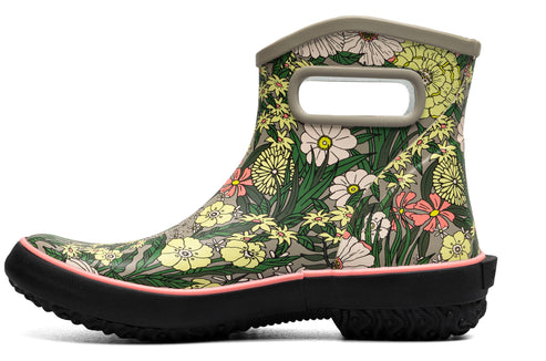 Floral print ankle boot with a pull handle.