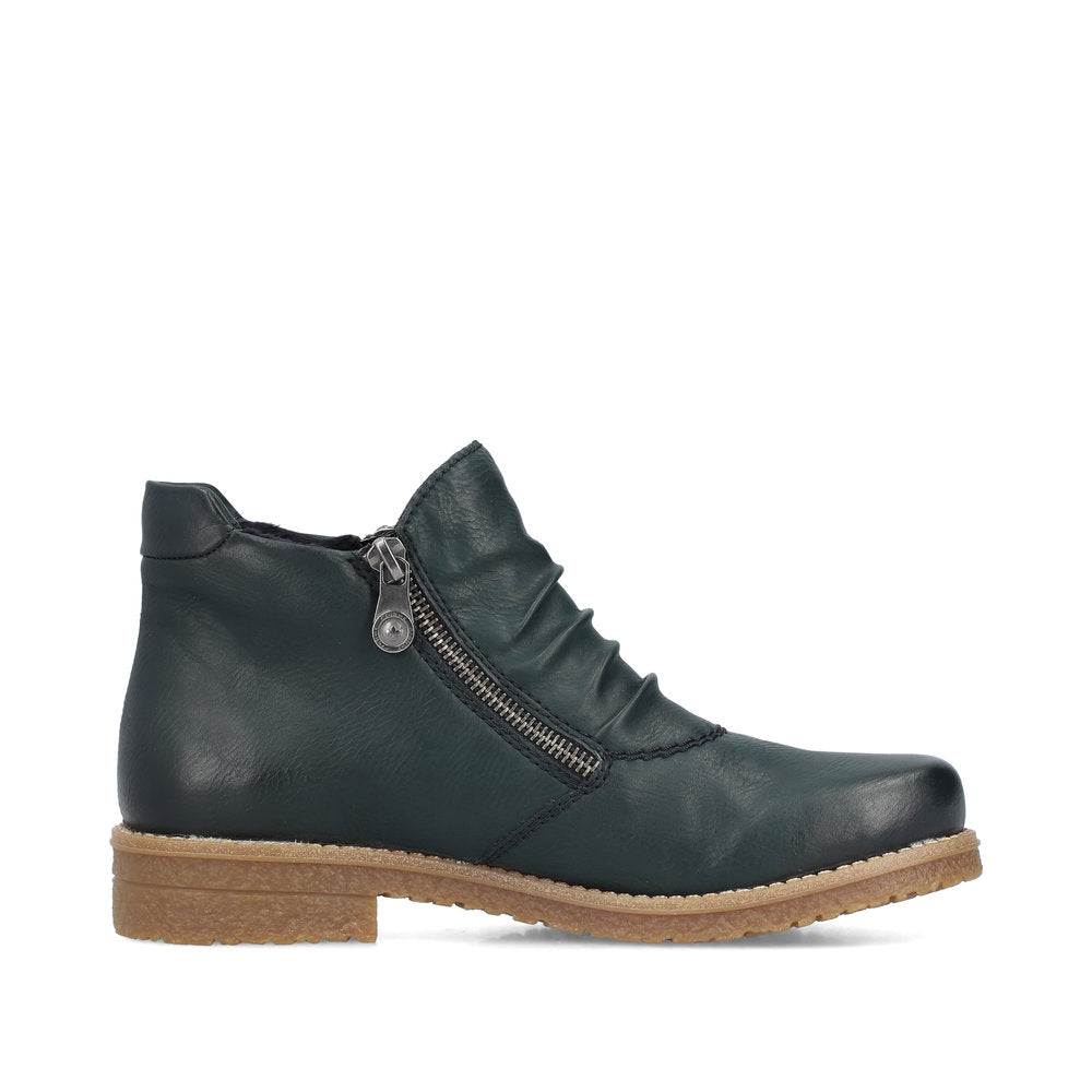 Green leather ankle boot with side zipper and tan sole.