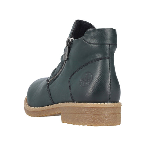 Green leather ankle boot with zipper and beige sole.