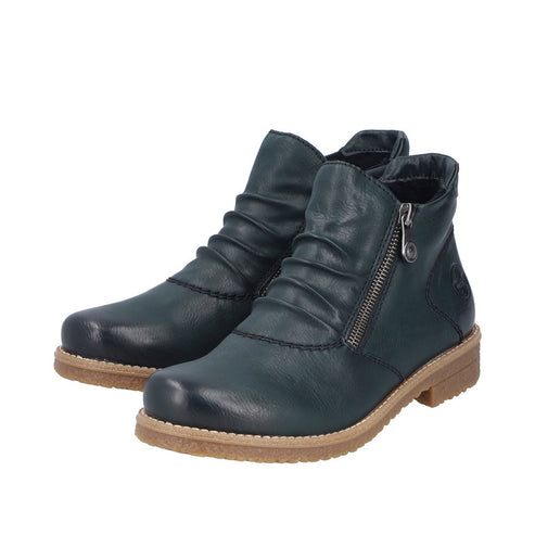 Pair of dark green ankle boots with side zipper, and scrunched vamp, on a tan sole.