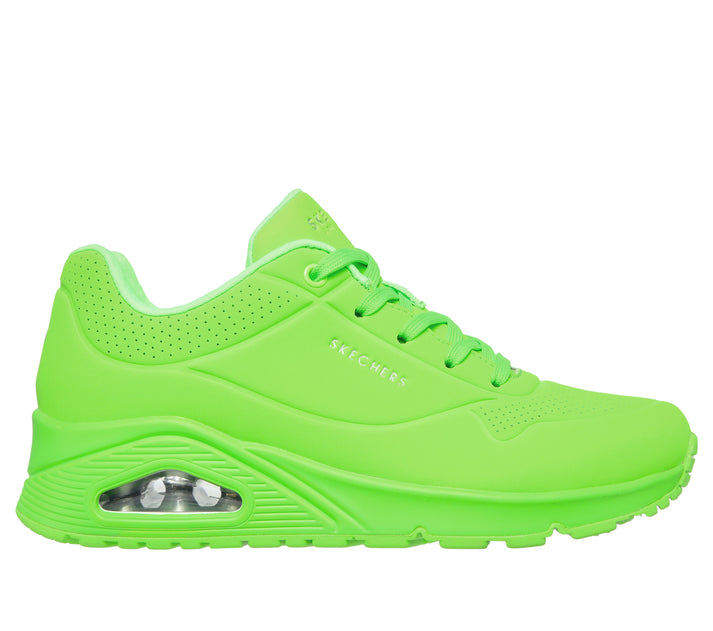 A side view of a lime green athletic shoe with air cushion.