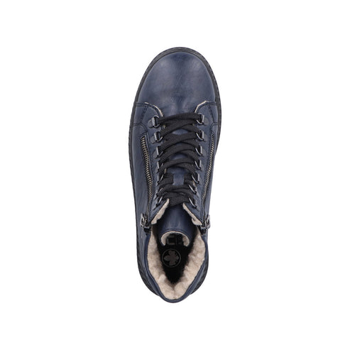 Top-down view of a blue, high-top shoe with laces and zippers and a visible faux fur lining.