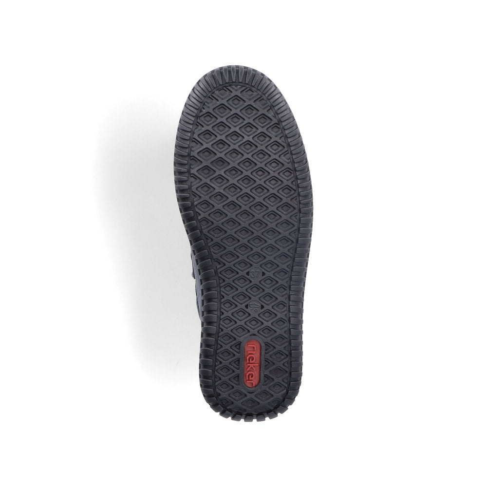 Shoe outsole with a textured diamond pattern and logo visible.