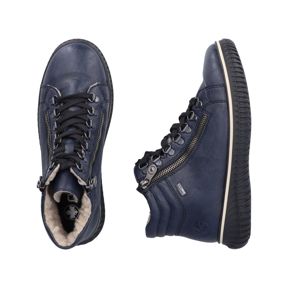 Two blue high-top sneakers with black laces and zipper closures; one shoe is shown from above and the other is on its side, revealing a faux fur lining.