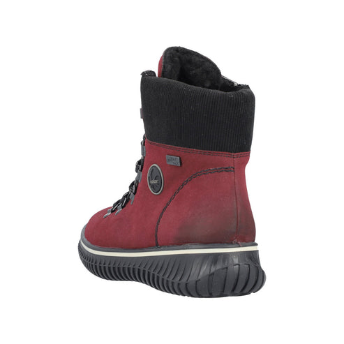 Back view of a red boot with black trim, featuring a padded collar and lug sole.