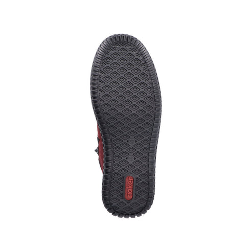 The sole of a shoe with diamond shaped treads and the word "rieker".