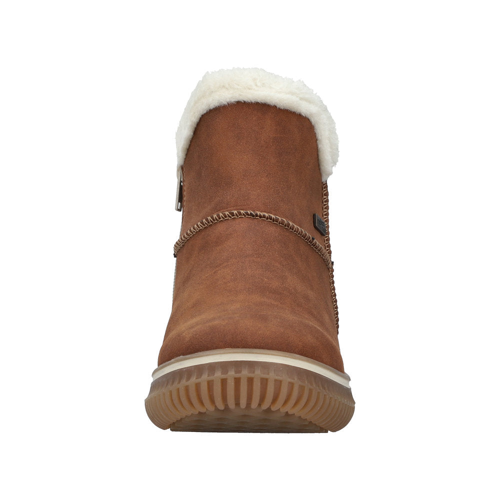 Tan ankle boot with white faux fur trim and ribbed rubber sole.