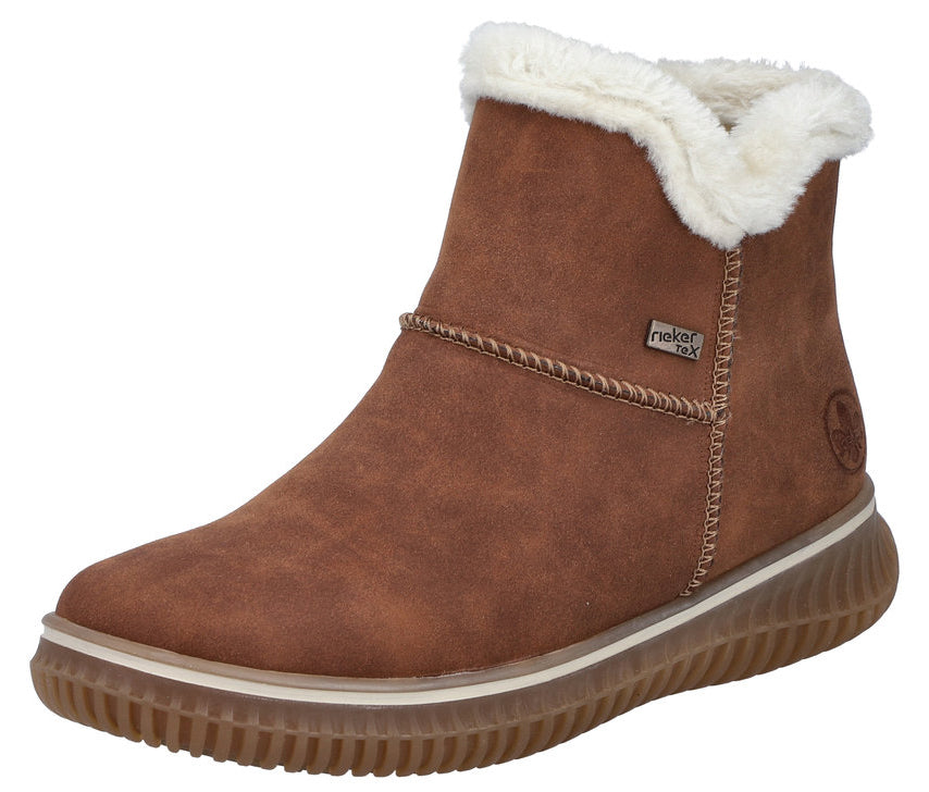 Brown ankle boot with white faux fur trim and thick ridged sole.
