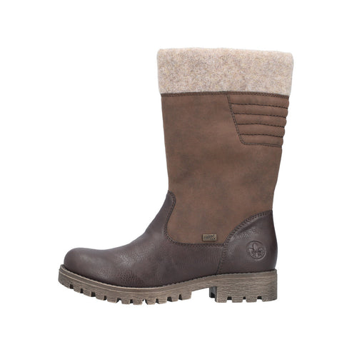 A mid-calf height brown boot with a chunky treaded sole and wooly cuff.