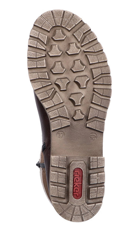 Sole of a shoe with deeply grooved, multi-directional lug pattern; numbers 37 and 4.  A red logo is visible in the center.