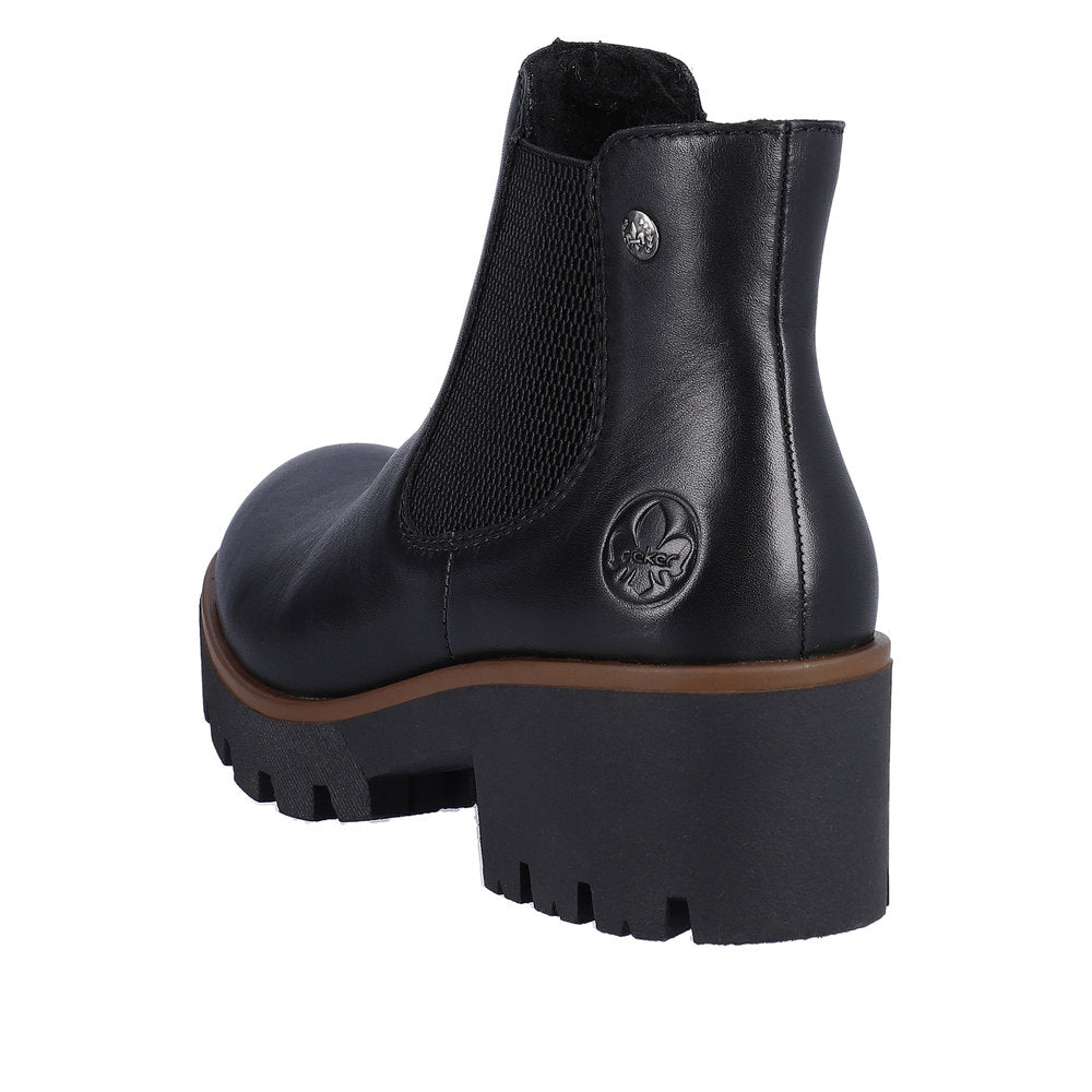 Black lug-sole Chelsea boot with a block heel and elastic side panels.