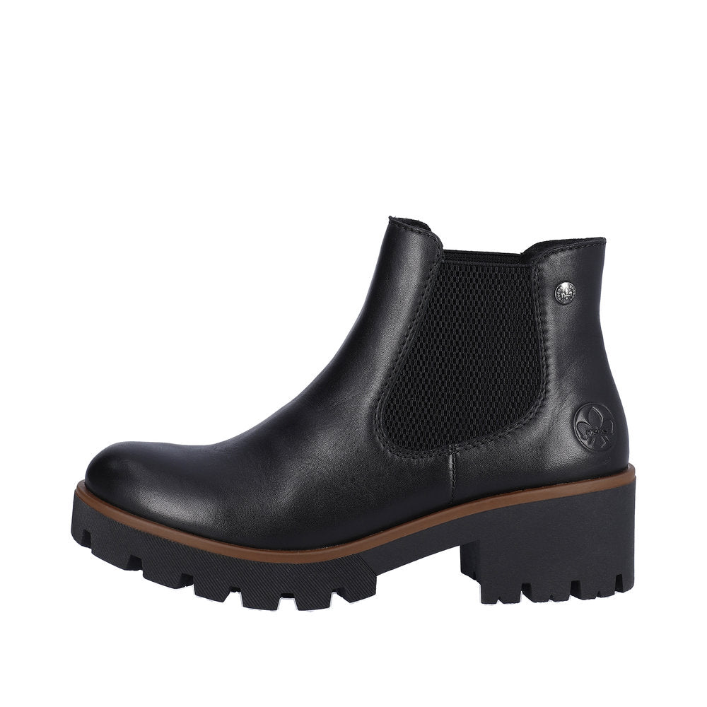 Black ankle boot with elastic side panels and a chunky lug sole.