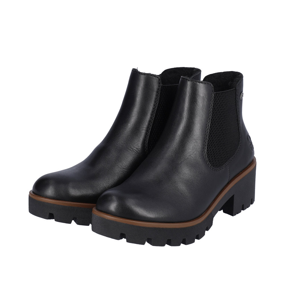 Pair of black leather heeled Chelsea boots.