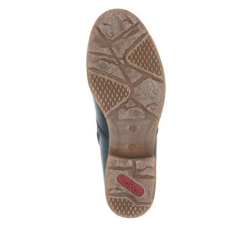 Close-up view from the bottom of a shoe with an intricate brown tread pattern and 'Rieker' logo.
