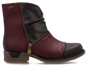 Ankle boot with a zipper, wrinkled top, and a combination of red and brown leather.