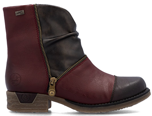 Ankle boot with a zipper, wrinkled top, and a combination of red and brown leather.