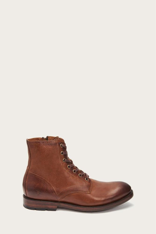 A brown leather lace-up boot with a side zipper.