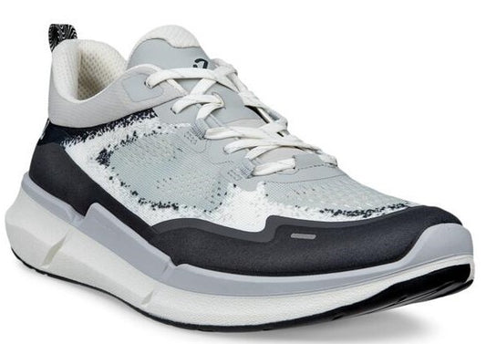 Low top sneaker with grey mesh upper, white laces and sole, and black accents.