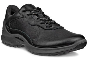 A black leather athletic shoe with black laces, perforated accents and a thick sole.
