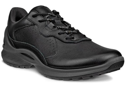 A black leather athletic shoe with black laces, perforated accents and a thick sole.