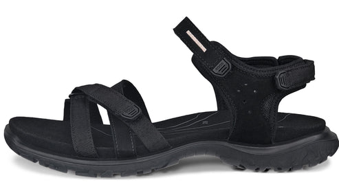 Black sandal with multiple straps and adjustable velcro closure.