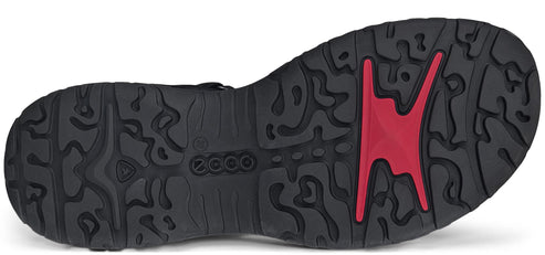 Shoe sole with black and red tread.