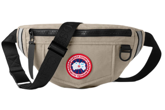 Beige belt bag with a black strap and logo patch.