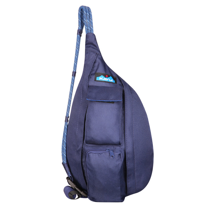 A blue teardrop-shaped bag with blue rope straps and a small front pocket labeled 'KAVU'.