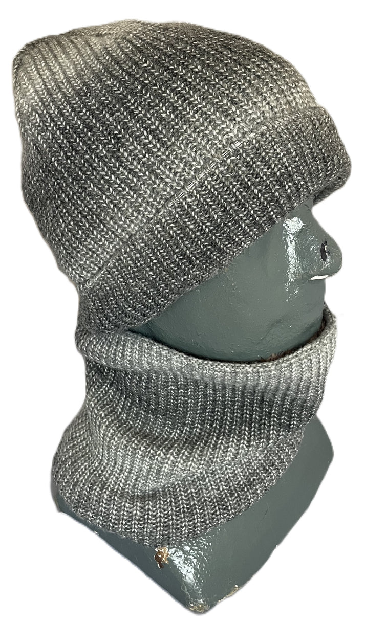 A gray and white ribbed knit beanie paired with a matching neck gaiter on a gray mannequin head.