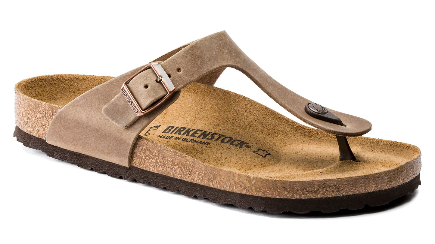 Single tan sandal with buckle and toe strap.