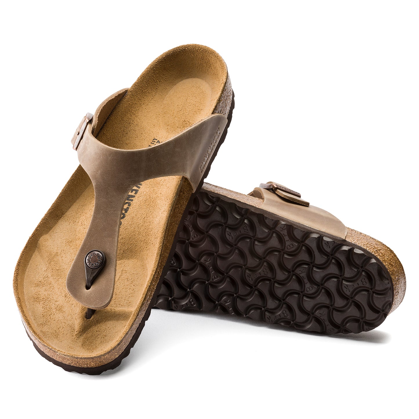 Two toe thong sandals with tan cork soles, one upright and one on its side.